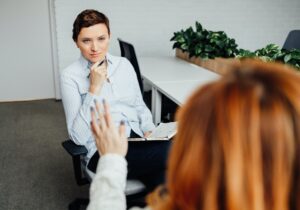 A psychologist meets with a client in the office